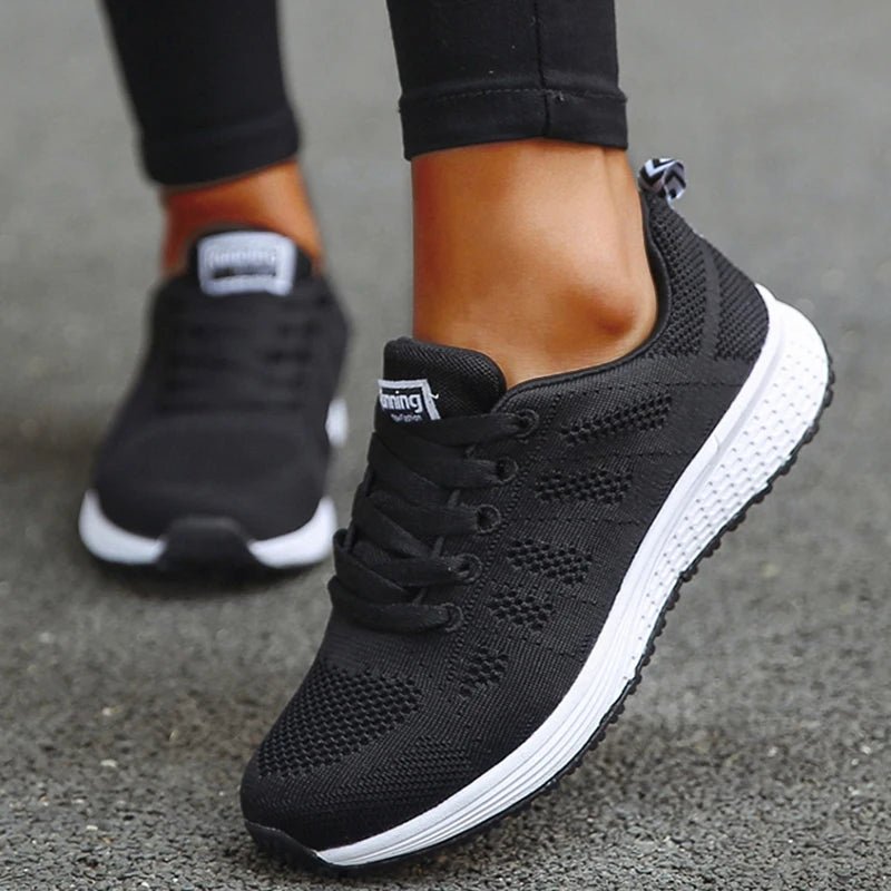 These black breathable mesh sneakers provide comfort and flexibility with a lightweight design. Perfect for running, walking, or everyday wear, featuring a cushioned sole for support.