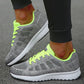 These grey and neon green breathable mesh sneakers provide comfort with a stylish edge. Designed with a cushioned sole for support, they are ideal for running and casual wear.