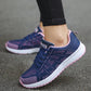 Women's breathable mesh sneakers in navy blue with pink accents, designed for active wear. These lightweight shoes offer excellent comfort and ventilation, perfect for running or casual outings.