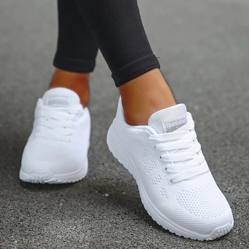 These all-white breathable mesh sneakers offer lightweight comfort and a sleek, versatile design. Perfect for both workouts and everyday wear, they provide support and style.