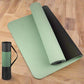 High-quality green yoga mat with a black anti-slip back and a carrying case, designed for durability, sweatproof and easy to clean, perfect for fitness routines.