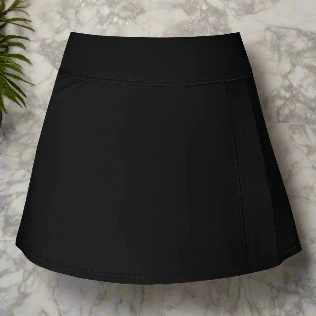 Black high-waisted swim skirt featuring a sleek, minimalist design, providing full coverage and a flattering silhouette, perfect for swim or beachwear.