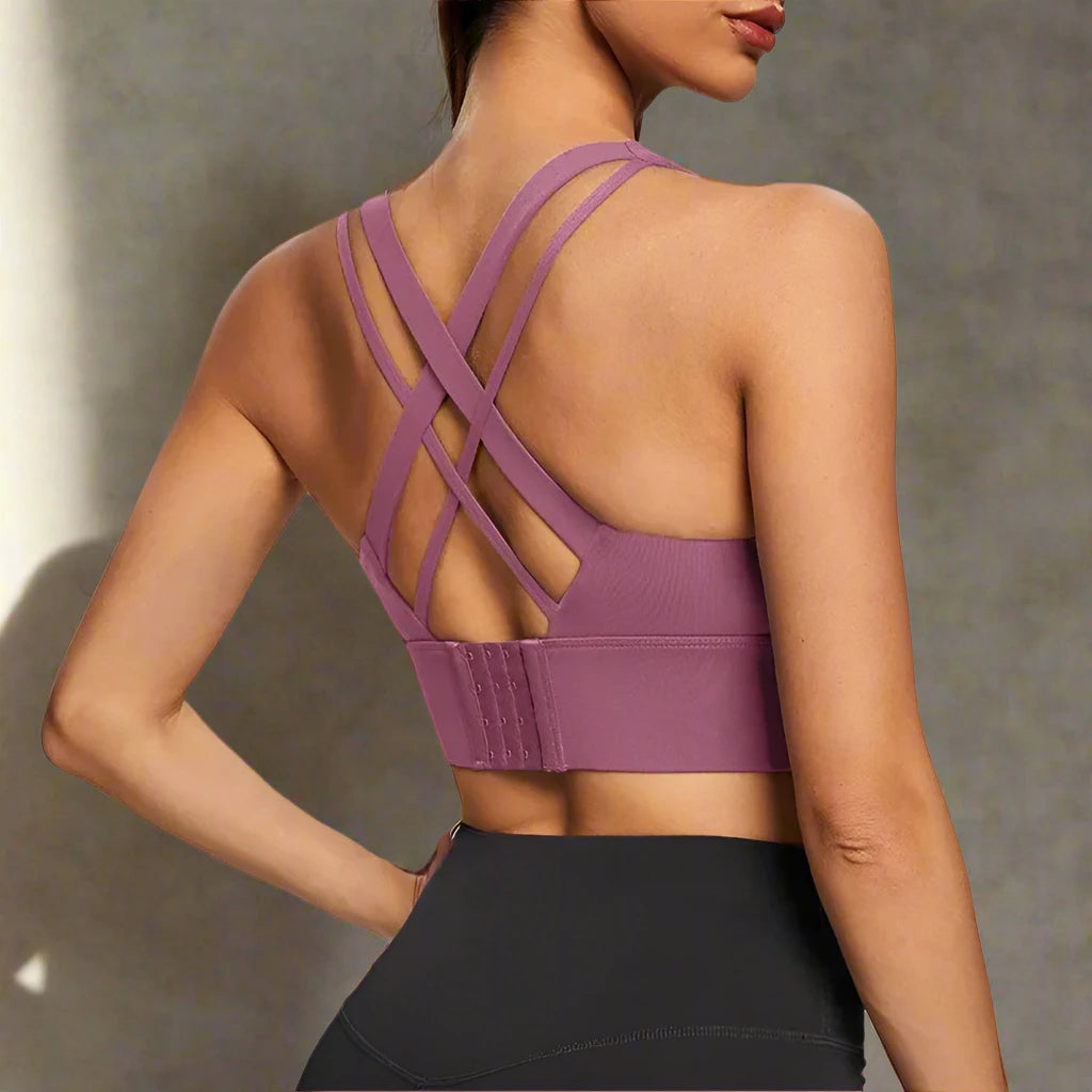 This image showcases a pink sports push-up bra featuring a crisscross back design for enhanced support and comfort. It combines fashion with function, perfect for workouts or casual wear.







