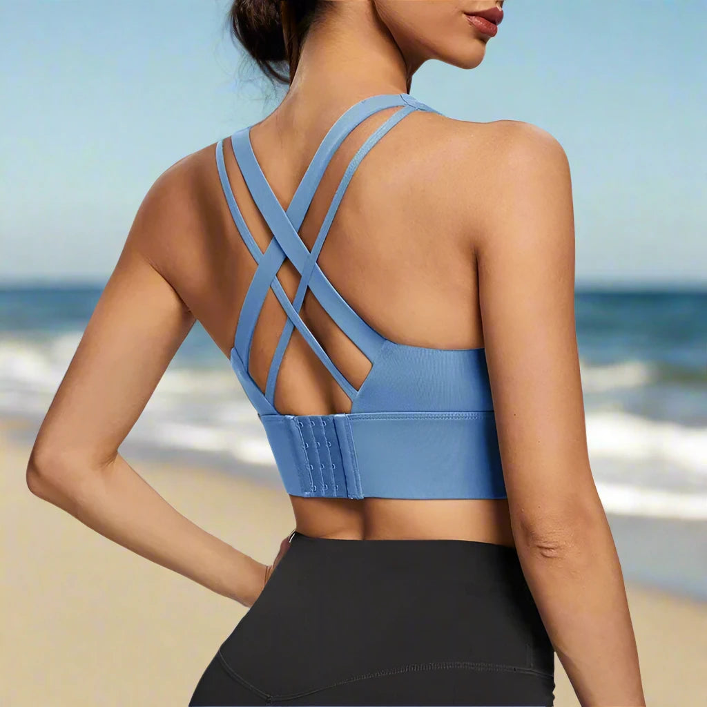 This image features a light blue sports push-up bra with a crisscross strap design at the back, offering both style and support. Ideal for high-impact activities and casual wear.