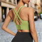 This image shows a stylish sports push-up bra in light green with a crisscross back strap design. It provides both support and style, ideal for high-impact workouts.