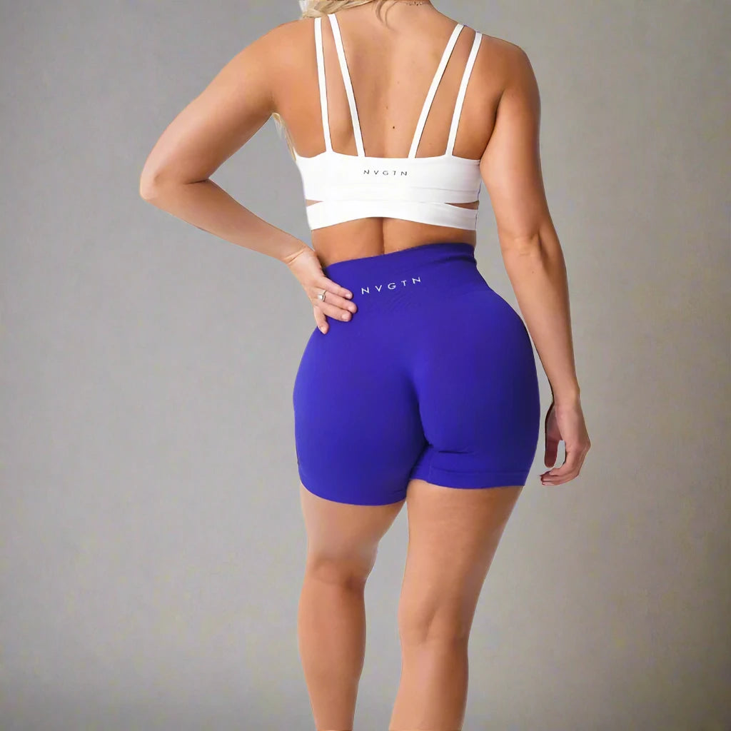 These purple high-waisted fitness shorts offer a flattering fit, ideal for gym sessions or casual wear. Made with stretchy, breathable fabric, they provide comfort and freedom of movement.