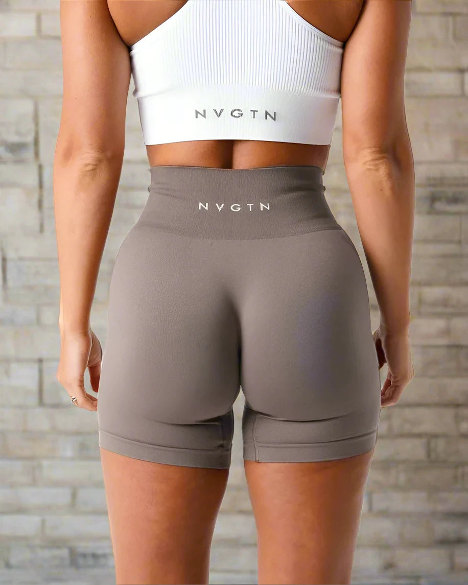 These grey high-waisted fitness shorts offer a seamless, comfortable fit, designed to enhance flexibility and support during workouts or casual wear, perfect for any activity.