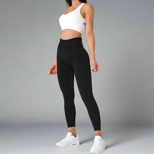 These black high-waisted workout tights offer a sleek and supportive fit, perfect for yoga, gym sessions, or casual wear. The stretchy, breathable fabric provides comfort and flexibility.