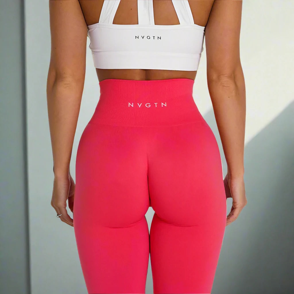 These vibrant pink high-waisted workout tights are designed for a snug fit that enhances your curves. The stretchy, breathable material ensures maximum comfort and support during workouts or casual wear.