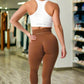 These high-waisted workout tights in a warm brown shade offer a seamless design for a smooth, sculpted look. Crafted with stretchy, breathable fabric, they ensure comfort and support during any workout.