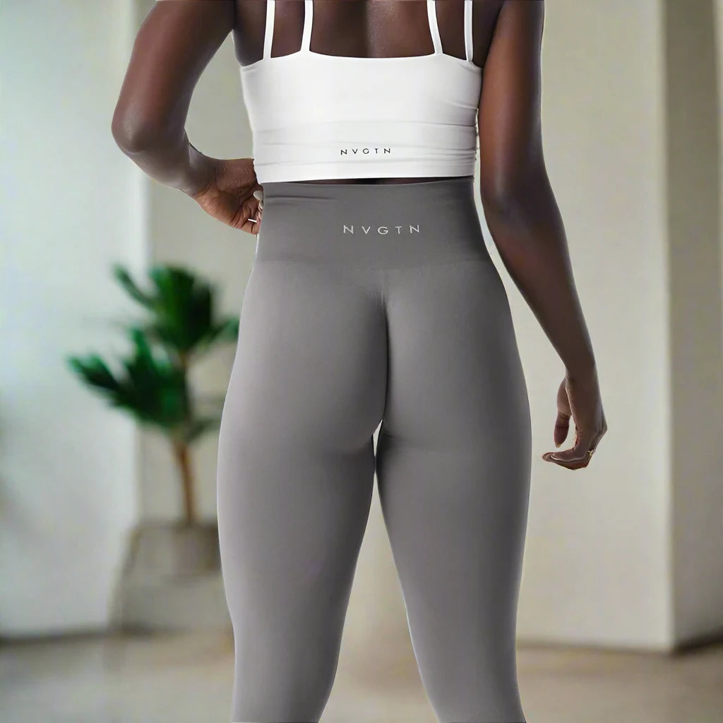 These high-waisted gray workout tights are perfect for providing comfort and support during intense workouts or casual wear, offering a sleek and flattering fit.