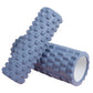 This gray foam roller is ideal for muscle massage and back training, featuring a textured surface for deep tissue relief and enhanced flexibility, aiding muscle recovery.